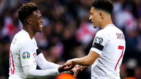 Jadon Sancho and Callum Hudson-Odoi celebrate