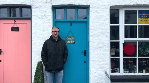 BBC/Ashitha Nagesh Jack standing in front of his family's cafe