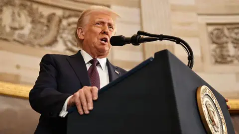 Getty Images Donald Trump at a podium in the Capitol building