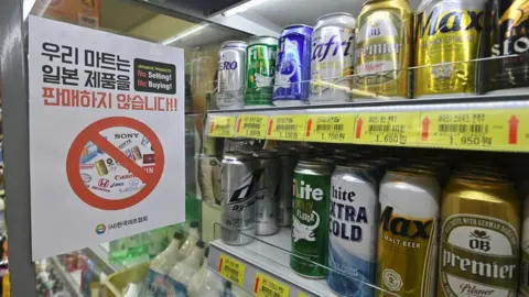 Getty Images Sign in a grocery shop in Seoul written in Korean saying "We do not sell Japanese products!"