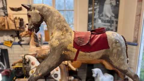 A side view of the rocking horse which is being restored by Peter Rix.