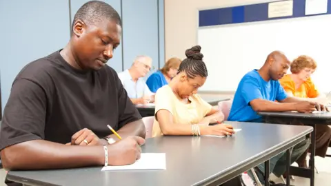 Shutterstock Class of adult college students