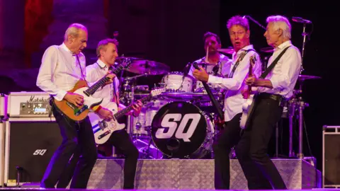EPA-EFE/REX/SHUTTERSTOCK Current five members of Status Quo perform on stage