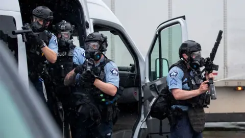 Police clash with protesters at the Minneapolis 3rd Police Precinct in May 2020