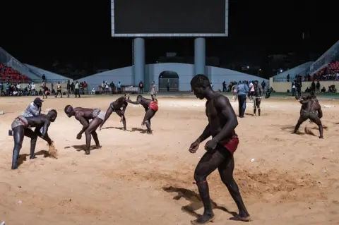 AFP Competitive wrestlers at an arena in Dakar, Senegal - Sunday 5 February 2023
