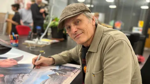 Jasmine Ketibuah-Foley/BBC Actor Viggo Mortensen signs a poster at the Watershed Cinema in Bristol