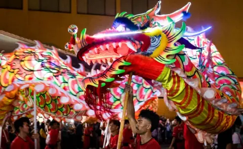 ADITYA AJI / AFP / Getty Images People perform a dragon dance during Cap Go Meh festival on the occasion of the last day for Lunar New Year of the Dragon celebrations, at a shopping mall in Bogor, West Java, on February 24, 2024