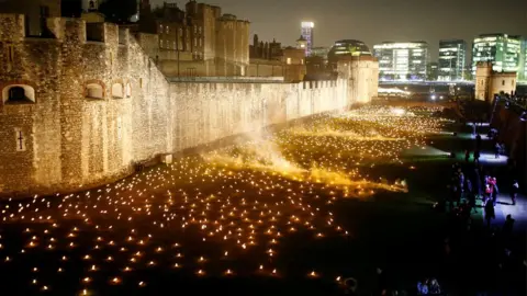Reuters The moat of the Tower of London are seen filled with thousands of lit torches as part of the installation "Beyond the Deepening Shadow", in London,