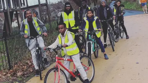 Bristol Somali Youth Voice A group of young people cycling with mentors at Bristol Somali Youth Voice