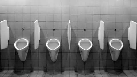 Black and white gents urinals toilets.