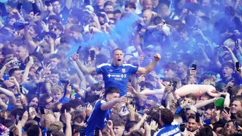 Zac Goodwin/PA Wire Fans celebratory after Ipswich Town is promoted to the Premier League