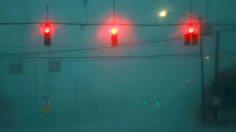 Reuters Heavy rain batters street lights in Orlando, Florida, as Hurricane Milton approaches the southern US state. Photo: 9 October 2024