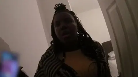 Durham Police A woman being spoken to by police