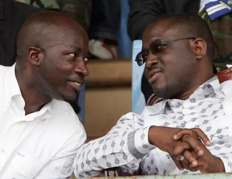 AFP Charles Blé Goudé and Guillaume Soro sit and talk at an event in 2007.