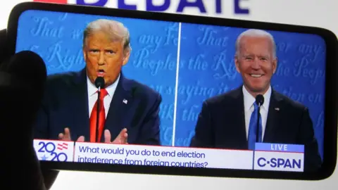 Donald Trump and Joe Biden are seen during the final presidential debate