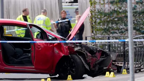 Jacob King/PA Wire The scene in Market Place, Arnold, where a man has suffered life-threatening injuries after a car hit multiple pedestrians in the town centre