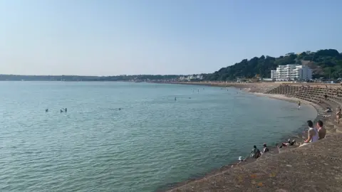BBC People swimming in bay in Jersey