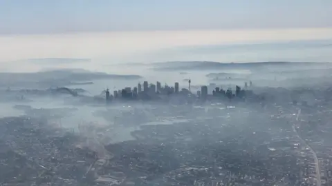 Reuters Aerial view of Sydney shrouded in smoke