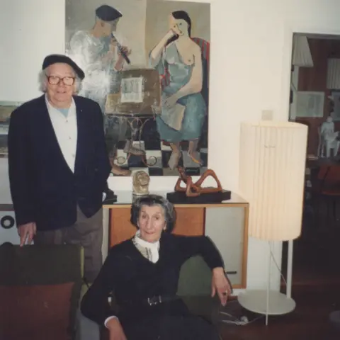 supplied The artist Mario Armengol is wearing a beret and standing in front of one of his own paintings. Rolindez De Madariaga, is setting next to him. They lived together later in life in Nottinghamshire.