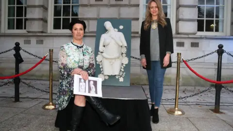 Belfast City Council Lord Mayor Kate Nicholl and artist Kelly Morris at unveiling of sculpture