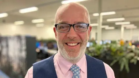 Andrew Sinclair/BBC Council director Phil Courtier