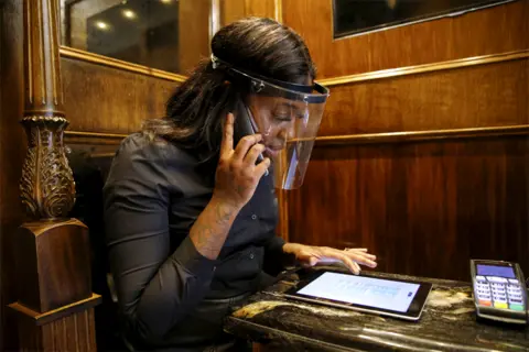 Getty Images A receptionist takes an appointment reservation over the phone