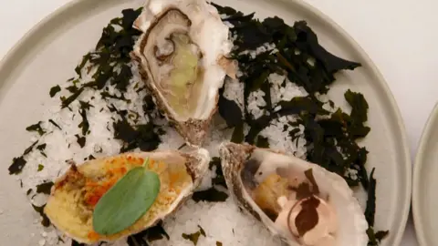 A trio of oysters cooked by Tom Rhodes