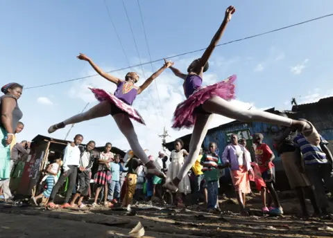 EPA Young ballerinas from different schools perform a dance during a ballet street performance to showcase their skills in Kibera slum, Nairobi, Kenya - Friday 30 November 2018.