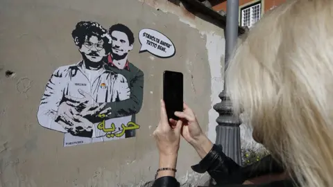 EPA The Zaky-Regeni mural by street artist Laika is just a stone's throw from the Egyptian embassy