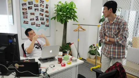 Getty Images Staff members at Sina Weibo in China
