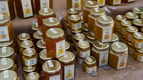 Getty Images Honey for sale at a shop in Italy