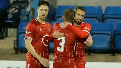 Alan Weir Loughgall's Mark Patton celebrates with his team-mates