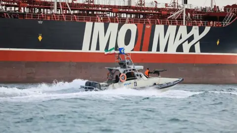 Getty Images Iranian guards patrolling the Stena Impero anchored off the Iranian port of Bandar Abbas