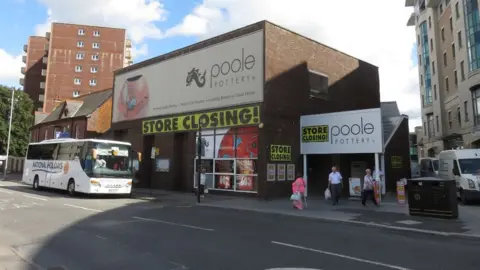 Richard Rogerson Poole Pottery with closing down banners