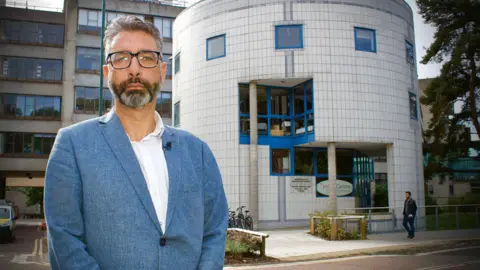 Martin Giles/BBC Asher Minns, executive director of the Tyndall Centre for Climate Change Research at the University of East Anglia