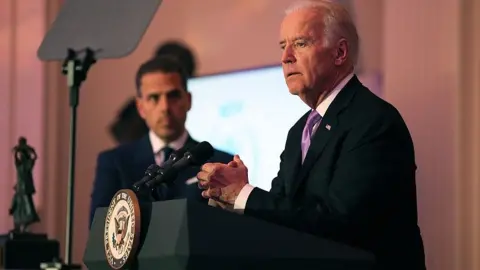 Getty Images Hunter Biden watches his father, the US vice-president, speak at an event in Washington in 2016