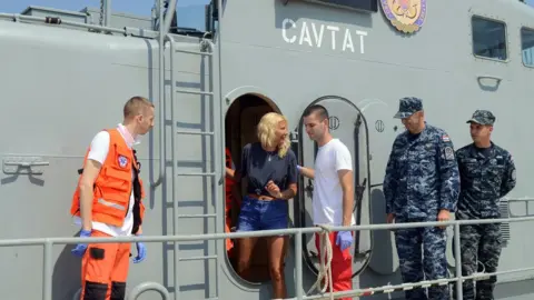 Getty Images British tourist Kay Longstaff (C) exits Croatia's coast guard ship in Pula, on August 20, 2018, which saved her after falling off a cruise ship near Croatian coast