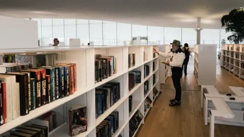 Getty Images Man in a library