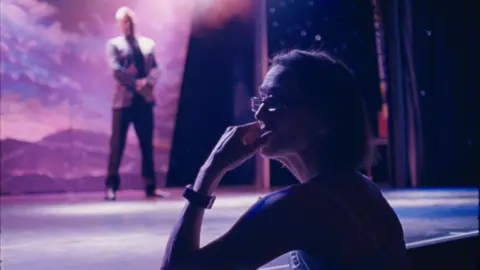 Seaside Special Di Cooke on edge of stage