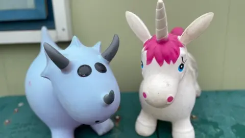 A dinosaur and unicorn toy