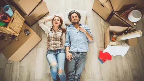 Getty Images Couple moving in