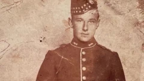 Family handout An old colourless image of John Gilbert in his military uniform.