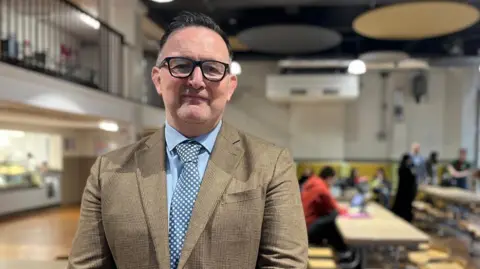 Neil McCallum staring straight at the camera. 