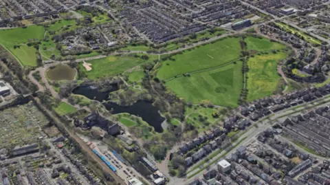 Image is a Google Earth rendering of Newsham Park in Liverpool, a large green space surrounded by housing