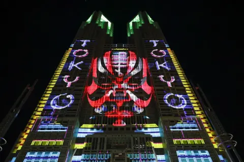 Rodrigo Reyes Marin/ZUMA Press Wire/REX/Shutterstock A projection mapping is displayed on the Tokyo Metropolitan Government building during the ''Happy New Year Tokyo 2025'' countdown event in Tokyo. 31 Dec 2024