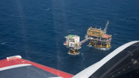 Sea Watch An aerial view of a gas platform in the middle of the sea