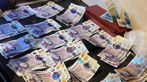 Money gathered in a police raid in Luton