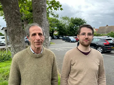 Ben Parker/BBC Two men in car park
