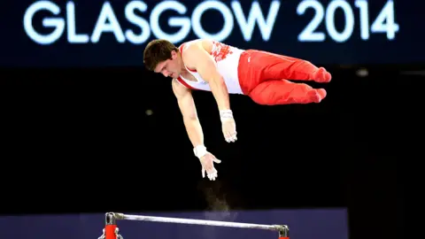 Getty Images Gymnast pictured during nan 2014 Glasgow Commonwealth Games 