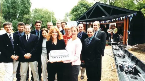 Sudbury Rowing Club Members of Sudbury Rowing Club holding a celebration cake